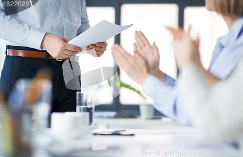 Image of business team at office meeting or presentation