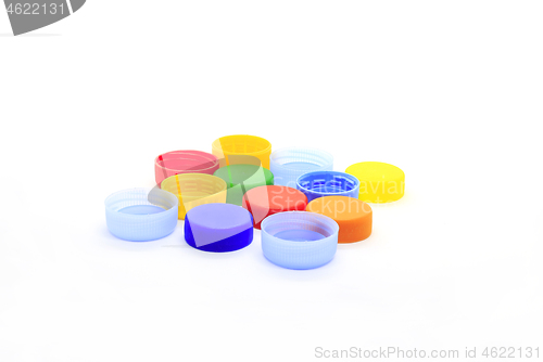 Image of Multicolored caps from plastic bottles on white background