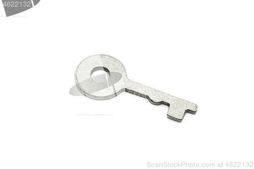 Image of Simple metallic key on white background