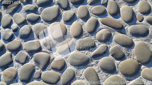 Image of Road paved with large stones, stone pavement, texture of the sto