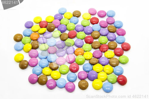 Image of Bright multicolored glazed chocolate candies on white