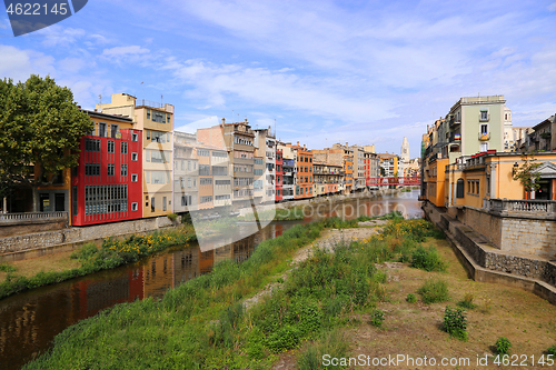 Image of Colorful houses and Eiffel bridge and river Onyar in Girona