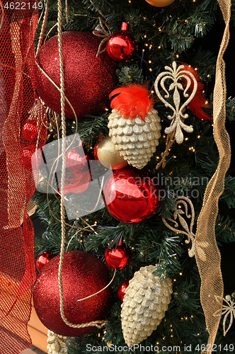 Image of Christmas decoration with balls, cones and ribbons