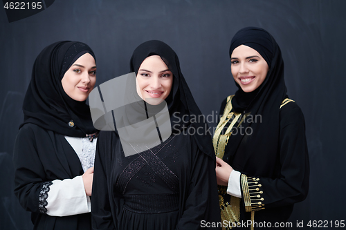 Image of portrait of beautiful muslim women in fashionable dress