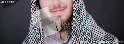 Image of portrait of arabian man in front of black chalkboard