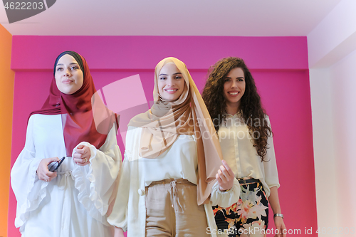 Image of muslim women in fashionable dress isolated on pink