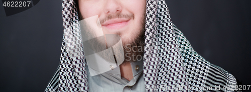 Image of portrait of arabian man in front of black chalkboard