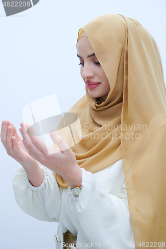 Image of muslim woman making traditional prayer to God