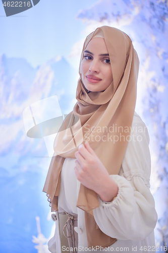 Image of portrait of beautiful muslim woman in fashionable dress