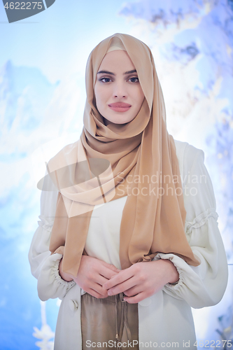 Image of portrait of beautiful muslim woman in fashionable dress