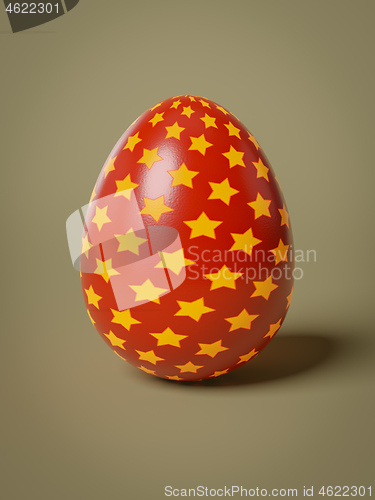 Image of red egg with yellow stars isolated