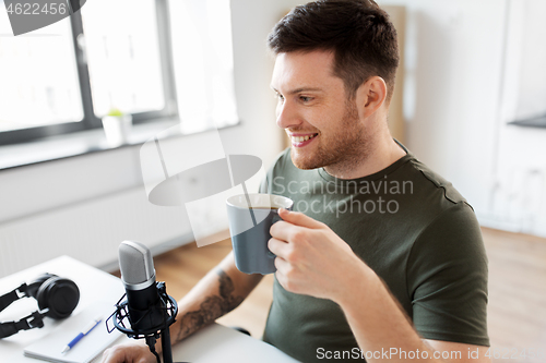 Image of blogger with coffee and microphone audio blogging
