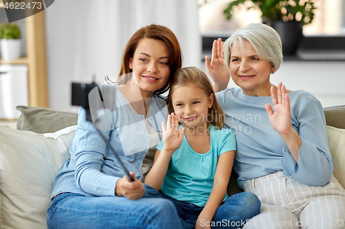 Image of mother, daughter and grandmother taking selfie