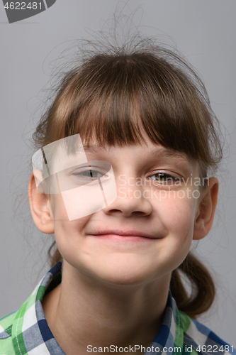 Image of Portrait of a happy ten-year-old girl of European appearance, close-up