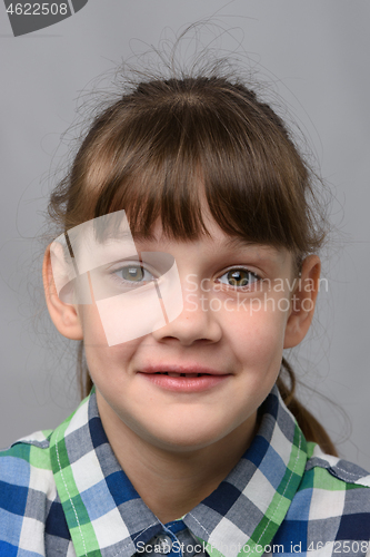 Image of Portrait of a joyfully surprised ten-year-old girl of European appearance, close-up