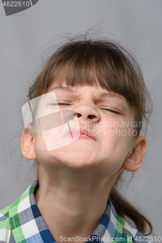 Image of Portrait of an arrogant ten-year-old girl of European appearance, close-up