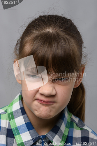 Image of Portrait of a vile ten-year-old girl of European appearance, close-up