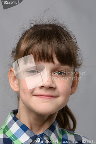 Image of Portrait of a self-confident ten-year-old girl of European appearance, close-up