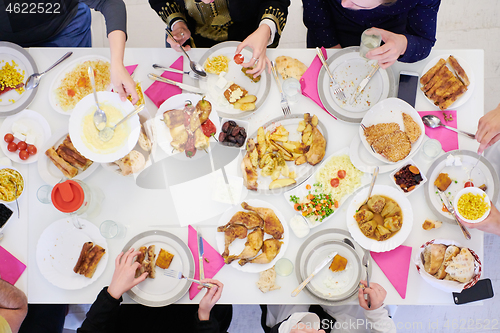 Image of muslim family having a Ramadan feast top view