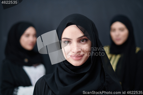 Image of portrait of beautiful muslim women in fashionable dress