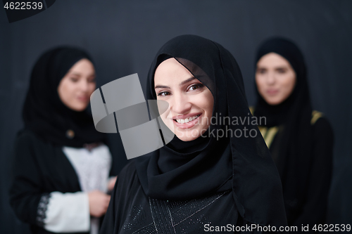 Image of portrait of beautiful muslim women in fashionable dress