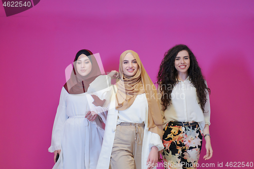 Image of muslim women in fashionable dress isolated on pink