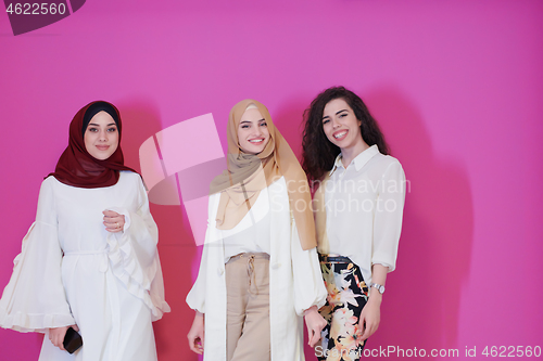 Image of muslim women in fashionable dress isolated on pink