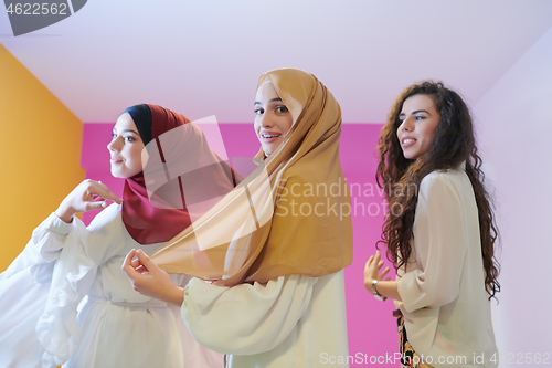 Image of muslim women in fashionable dress isolated on pink