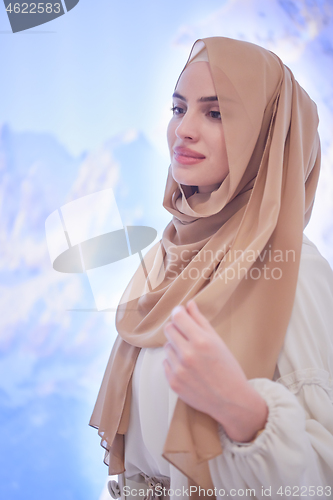 Image of portrait of beautiful muslim woman in fashionable dress