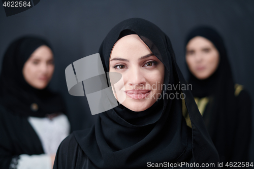 Image of portrait of beautiful muslim women in fashionable dress