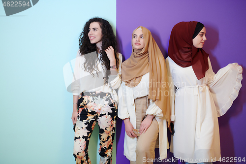 Image of muslim women in fashionable dress isolated on colorful backgroun