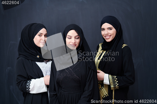 Image of portrait of beautiful muslim women in fashionable dress