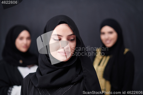 Image of portrait of beautiful muslim women in fashionable dress