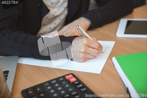 Image of Caucasian entrepreneur, businessman, manager working concentrated in office