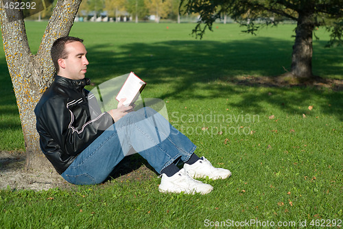 Image of Man Reading Outside