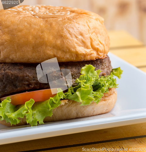 Image of Roll And Burger Indicates Ready To Eat And Beef