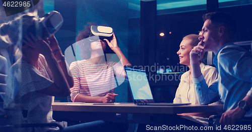 Image of Multiethnic Business team using virtual reality headset