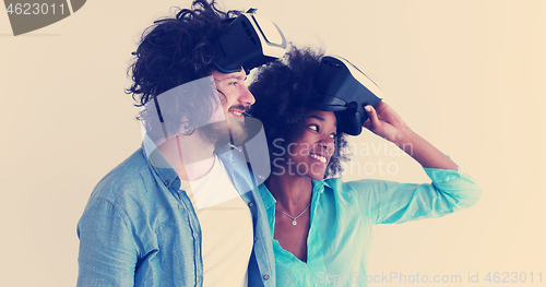 Image of multiethnic couple getting experience using VR headset glasses