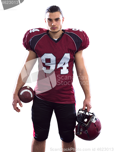 Image of Portrait of American football player pointing against white back