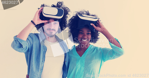 Image of multiethnic couple getting experience using VR headset glasses