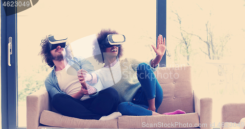 Image of Multiethnic Couple using virtual reality headset