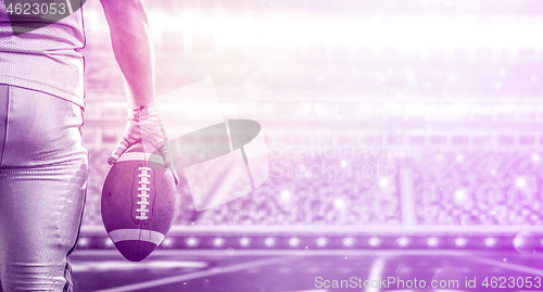 Image of closeup American Football Player isolated on big modern stadium