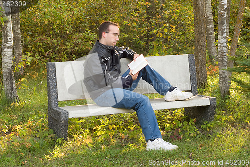 Image of Man Reading on a Bench