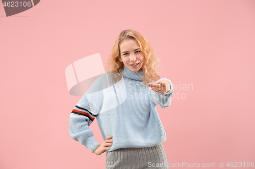 Image of The happy business woman point you and want you, half length closeup portrait on pink background.