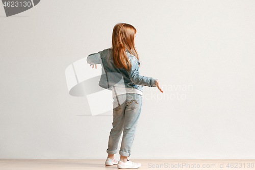 Image of Full length portrait of cute little kid in stylish jeans clothes