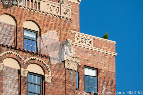 Image of red brick building detail with stone figure in New York City