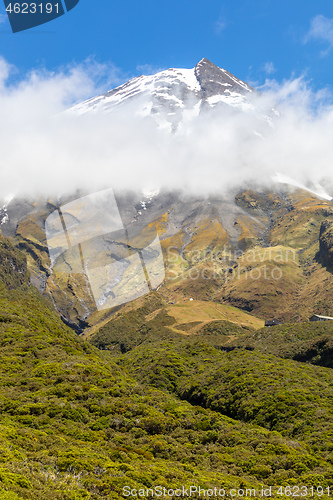 Image of volcano Taranaki covered in clouds, New Zealand 