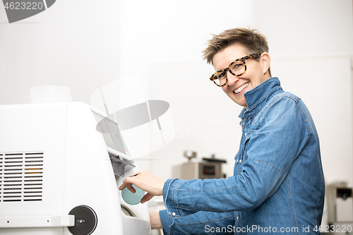 Image of woman hone the edge of the eyeglasses