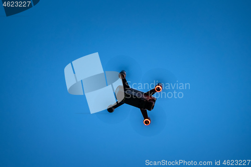 Image of toy drone blue sky background 