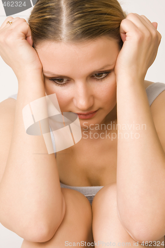 Image of young beautiful sad woman